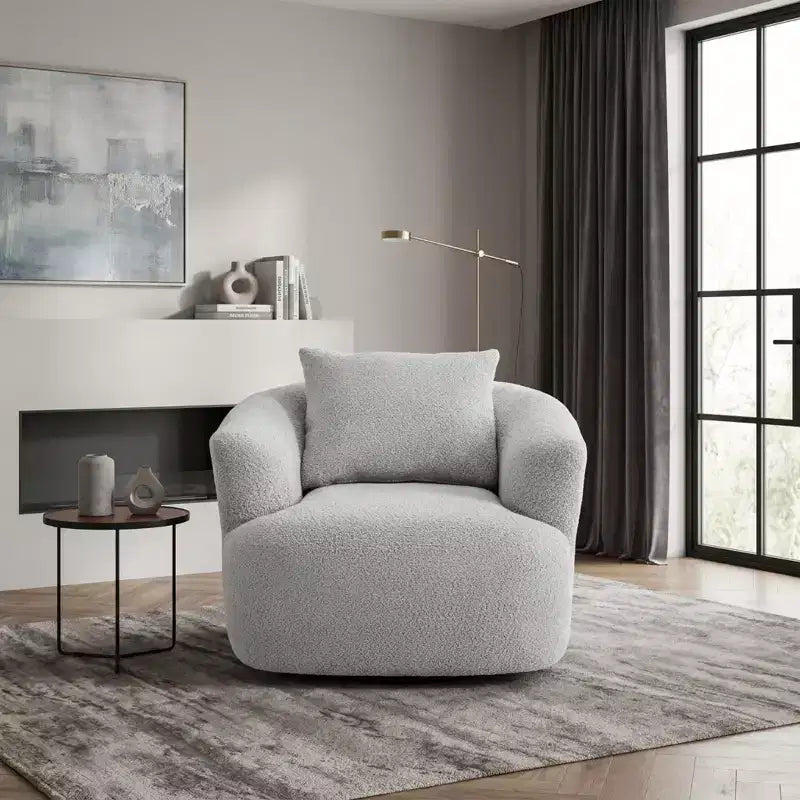 Poltrona girevole a 360° con cuscino decorativo