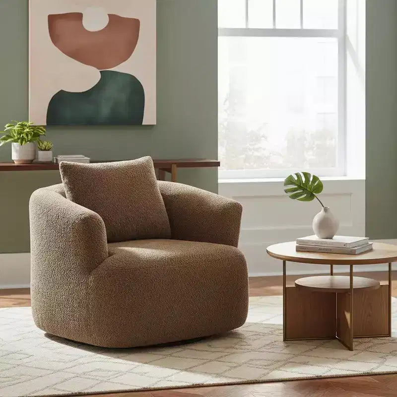 Poltrona girevole a 360° con cuscino decorativo